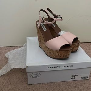 pink platforms,minor scratch in the front. in good condition with box
